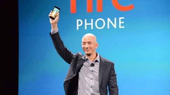 Jeff Bezos triumphantly raises his Fire Phone at the device's launch.